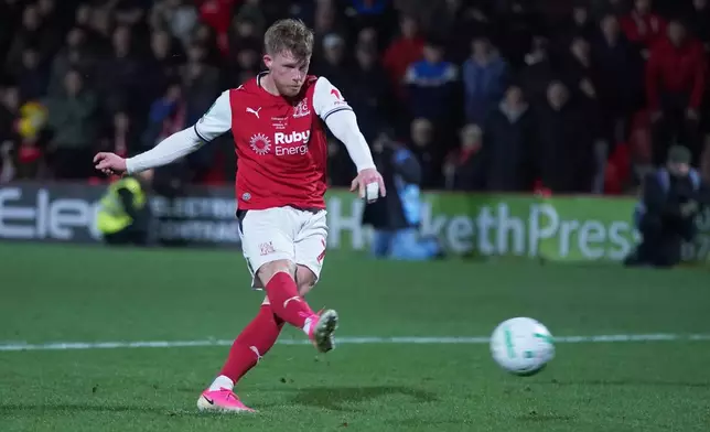 Fleetwood's Andy Cannon kicks on a penalty shootout during the English League Cup soccer match between Fleetwood Town and Arsenal in Fleetwood, England, Tuesday, Oct. 27, 2026. (AP Photo/Ian Hodgson)