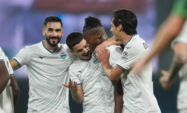 Lazio's Tijjani Noslin, second from right, celebrates after scoring a goal during the Serie A soccer match between Sassuolo and Lazio in Reggio Emilia, Italy, Tuesday, Oct. 27, 2026. (Massimo Paolone/LaPresse via AP)