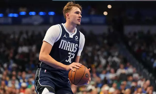 Dallas Mavericks forward Cooper Flagg (32) prepares to shoot during the first half of an NBA Cup basketball game against the Houston Rockets in Dallas, Friday, Oct. 30, 2026. (AP Photo/Tony Gutierrez)