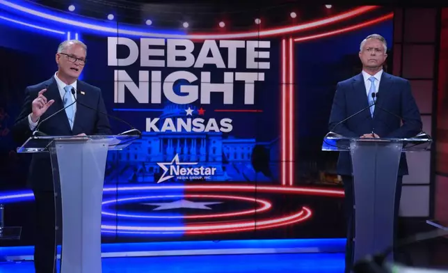 Republican Sen. Roger Marshall, right, and Democratic nominee for U.S. Senate Adam Hamilton participate in a debate at WDAF TV in Kansas City, Mo., Wednesday, Oct. 21, 2026. (AP Photo/Charlie Riedel, Pool)