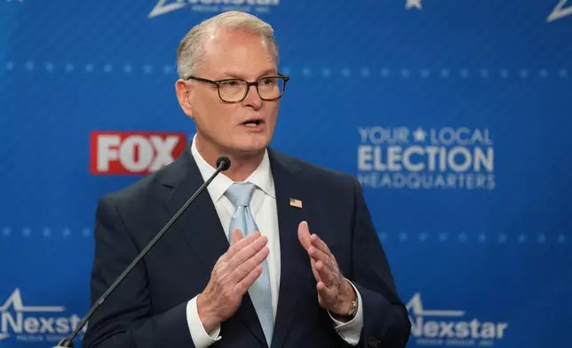 Democratic nominee for U.S. Senate Adam Hamilton talks to the media after a debate with Republican Sen. Roger Marshall at WDAF TV in Kansas City, Mo., Wednesday, Oct. 21, 2026. (AP Photo/Charlie Riedel)