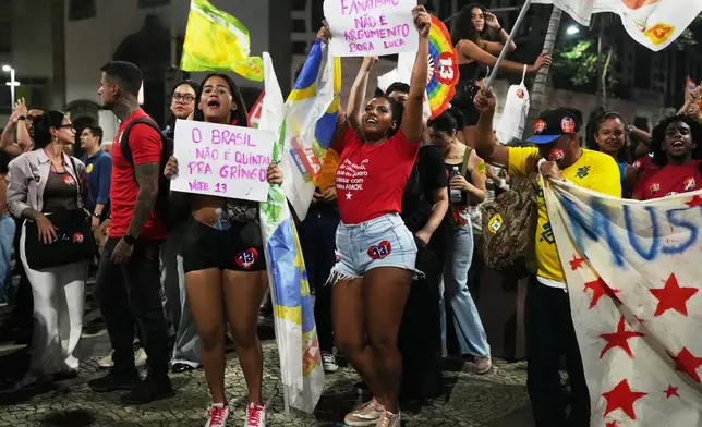Supporters of Brazilian President Luiz Inacio Lula da Silva, who is running for reelection, shout slogans during a rally ahead of the presidential runoff election, in Rio de Janeiro, Wednesday, Oct. 14, 2026. (AP Photo/Silvia Izquierdo)