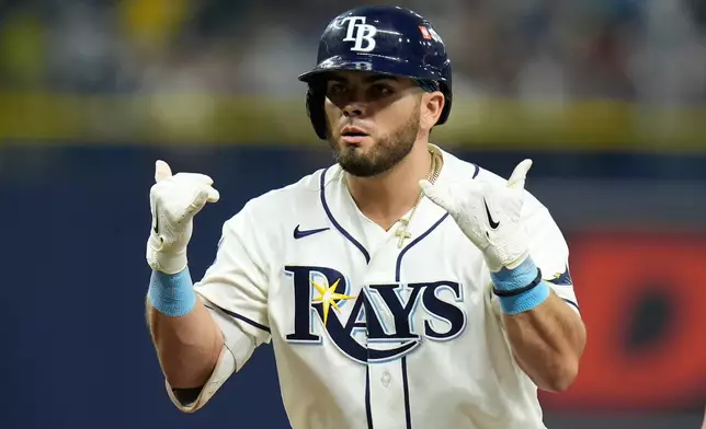Tampa Bay Rays' Jonathan Aranda celebrates hitting a single during the fifth inning in Game 2 of an American League Division Series baseball game against the New York Yankees Monday, Oct. 5, 2026, in St. Petersburg, Fla. (AP Photo/Chris O'Meara)