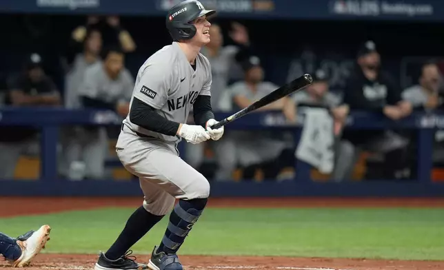 New York Yankees' Ben Rice watches his solo home run during the fourth inning in Game 2 of an American League Division Series baseball game against the Tampa Bay Rays Monday, Oct. 5, 2026, in St. Petersburg, Fla. (AP Photo/Chris O'Meara)