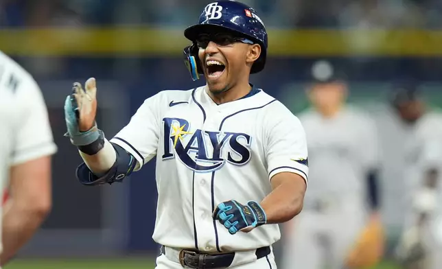 Tampa Bay Rays' Richie Palacios celebrates after hitting a two-run single during the fifth inning in Game 2 of an American League Division Series baseball game against the New York Yankees Monday, Oct. 5, 2026, in St. Petersburg, Fla. (AP Photo/Chris O'Meara)