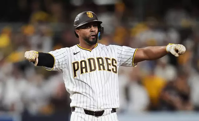 San Diego Padres Xander Bogaerts reacts after reaching on a double against the Chicago Cubs in the fourth inning of Game 2 of the National League Wild Card baseball playoff series Wednesday, Sept. 30, 2026, in San Diego. (AP Photo/Gregory Bull)