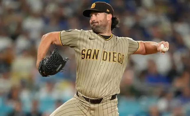 San Diego Padres starting pitcher Robbie Ray throws to the plate during the first inning of a baseball game against the Los Angeles Dodgers, Wednesday, Sept. 23, 2026, in Los Angeles. (AP Photo/Mark J. Terrill)