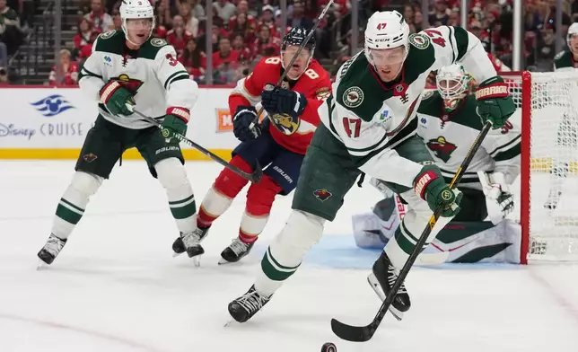 Minnesota Wild center Michael McCarron (47) skates with the puck during the second period of an NHL hockey game against the Florida Panthers, Saturday, Oct. 10, 2026, in Sunrise, Fla. (AP Photo/Lynne Sladky)