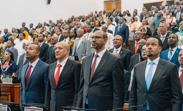 Members of the parliament stand during the national anthem at a session of the Ethiopian Parliament in Addis Ababa, Ethiopia, Monday, Oct. 5, 2026. (Ethiopian Prime Minster's Office via AP)