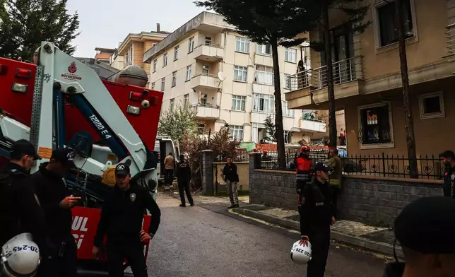 Police and rescue team members work next to a partially collapsed seven-storey building in Istanbul, Thursday, Oct. 8, 2026. (Abdullah Tepeli/DIA Photo via AP)