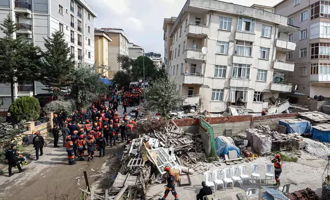 Firefighters and rescue team members work next to a partially collapsed seven storey building in Istanbul, Thursday, Oct. 8, 2026. (Abdullah Tepeli/DIA Photo via AP)