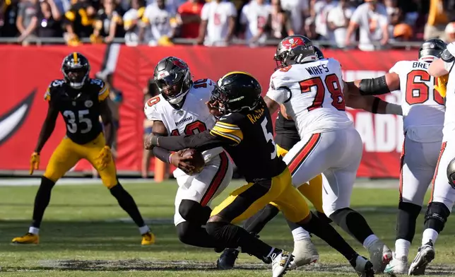 Pittsburgh Steelers cornerback Jalen Ramsey (5) sacks Tampa Bay Buccaneers quarterback Jalon Daniels (10) in overtime during an NFL football game in Tampa, Fla., Sunday, Oct. 18, 2026. (AP Photo/Chris O'Meara)