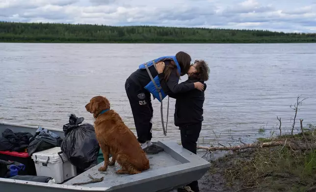 Alara Woods kisses her grandmother Janet Woods, right, goodbye in Rampart, Alaska, as she prepares to return to Fairbanks, Monday, July 13, 2026. (AP Photo/Annika Hammerschlag)