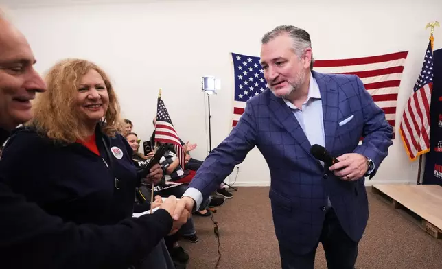 Sen. Ted Cruz, R-Texas greets supporters for Republican nominee for U.S. Senate Mike Rogers during a campaign event Wednesday, Oct. 28, 2026, in Grosse Pointe Woods, Mich. (AP Photo/Paul Sancya)