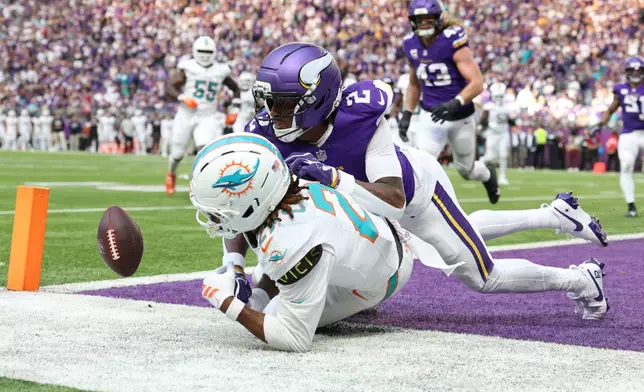 Minnesota Vikings cornerback Isaiah Rodgers (2) breaks up a pass intended for Miami Dolphins wide receiver Kevin Coleman Jr. during the second half of an NFL football game Sunday, Oct. 4, 2026, in Minneapolis. (AP Photo/Matt Krohn)