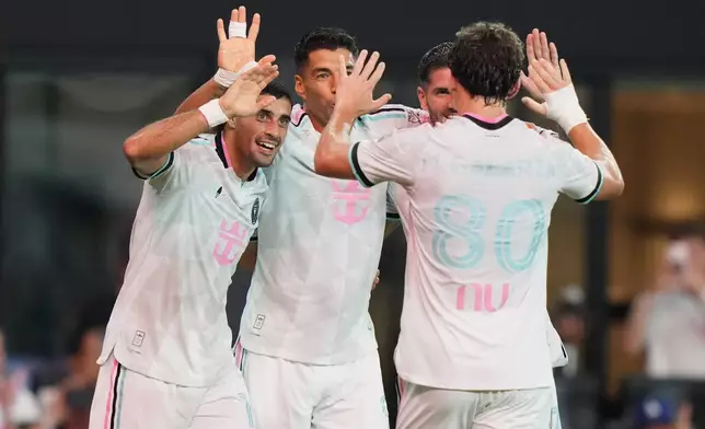 Inter Miami forward Germán Berterame, left, is congratulated after scoring a goal during the first half of an MLS soccer match against New York City FC, Wednesday, Oct. 14, 2026, in Miami. (AP Photo/Lynne Sladky)