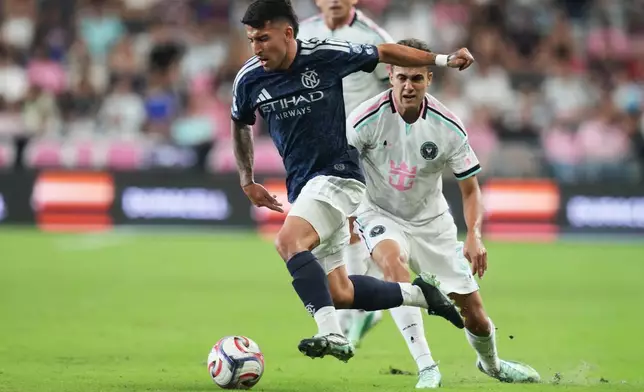 New York City FC midfielder Nicolás Fernández Mercau, left, runs with the ball during the first half of an MLS soccer match against Inter Miami, Wednesday, Oct. 14, 2026, in Miami. (AP Photo/Lynne Sladky)