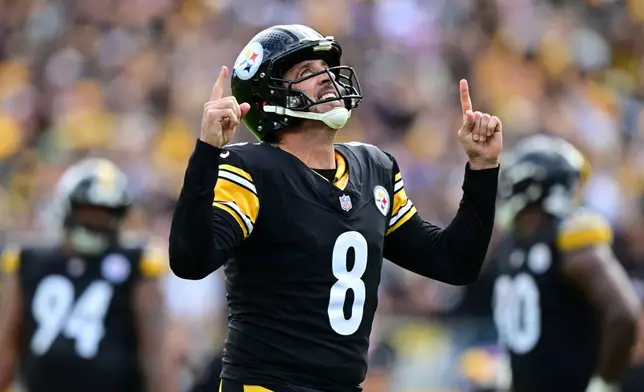 Pittsburgh Steelers quarterback Aaron Rodgers (8) celibates a touchdown pass against the Indianapolis Colts during the second half of an NFL football game in Pittsburgh, Sunday, Oct. 11, 2026. (AP Photo/David Dermer )