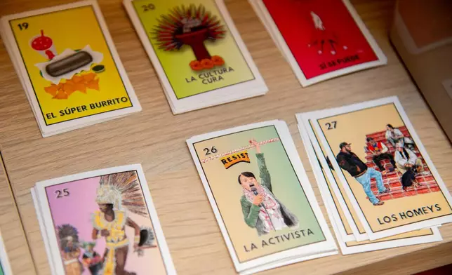 Cards featuring local references, including a No. 26 card representing resistance are displayed at the Mission Loteria store on Friday, Oct. 9, 2026, in San Francisco. (AP Photo/Akash Pamarthy)