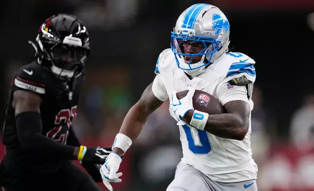 Detroit Lions running back Jahmyr Gibbs (0) runs the ball against the Arizona Cardinals during the first half of an NFL football game in Glendale, Ariz., Sunday, Oct. 11, 2026. (AP Photo/Ross D. Franklin)