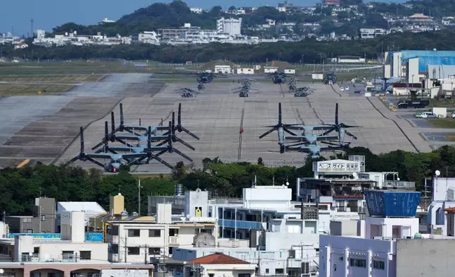 FILE - U.S. MV-22 Osprey transport aircraft are parked at the U.S. Marine Corps Air Station Futenma in Ginowan, on the main island of the Okinawa archipelago, southern Japan, Tuesday, Feb. 18, 2025. (AP Photo/Hiro Komae, File)