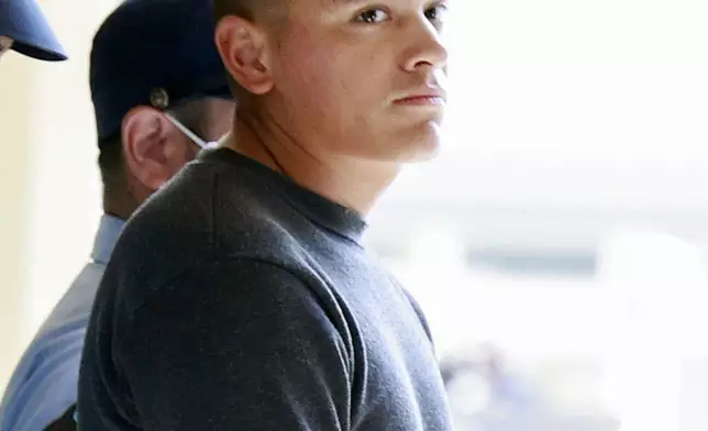 Devin Jacob Ballard, a U.S. Marine who has been in custody in an alleged robbery and murder of a woman on Japan's southern island of Okinawa, is sent over to the Naha prosecutors' office in Japan, Monday, Oct. 5, 2026. (Kotaro Ueda/Kyodo News via AP)