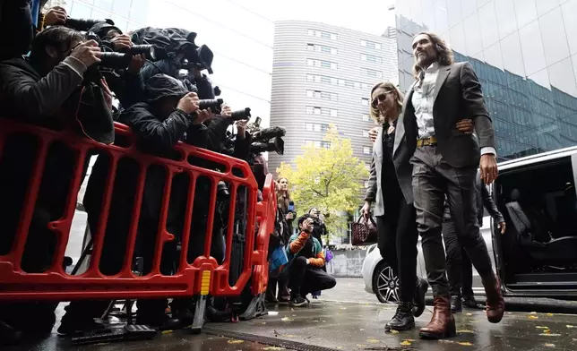 Russell Brand arrives at Southwark Crown Court, London, Tuesday, Oct. 27, 2026, where he faces three charges of rape, indecent assault, and three counts of sexual assault, relating to six women. (Jordan Pettitt/PA via AP)