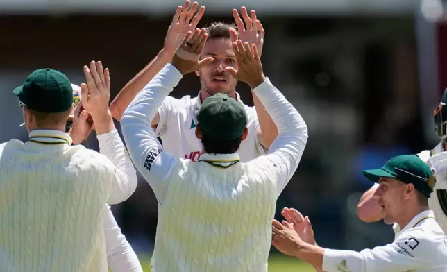 South Africa's Marco Jansen, centre, celebrates the wicket of Australia's Matt Renshaw during day four of the second cricket test match between South Africa and Australia, in Gqeberha, South Africa, Wednesday, Oct. 21, 2026. (AP Photo/Themba Hadebe)
