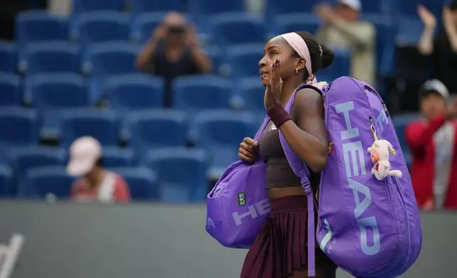 Coco Gauff of the United States leaves the court after losing against Elise Mertens of Belgium in the fourth round of the women's singles match at the China Open tennis tournament in Beijing, Wednesday, Oct. 7, 2026. (AP Photo/Achmad Ibrahim)