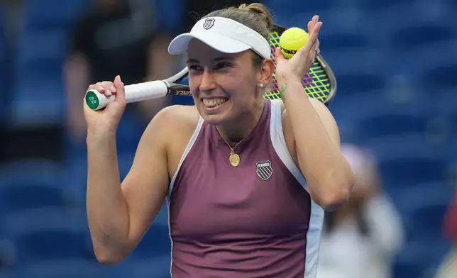 Elise Mertens of Belgium celebrates after defeating Coco Gauff of the United States in the fourth round of the women's singles match at the China Open tennis tournament in Beijing, Wednesday, Oct. 7, 2026. (AP Photo/Achmad Ibrahim)