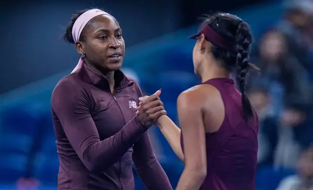 Coco Gauff of the United States, shake hands with Xinran Sun of China, after winning the third round of the women's singles match at the China Open tennis tournament in Beijing, Monday, Oct. 5, 2026. (AP Photo/Andy Wong)