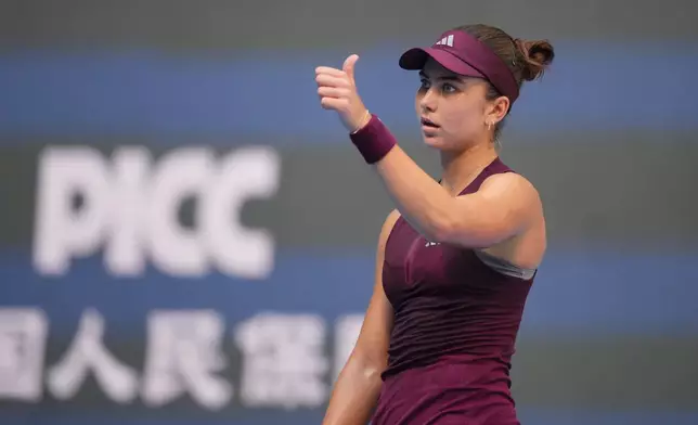 Iva Jovic of the United States reacts during play against Iga Swiatek of Poland during the fourth round of the women's singles match at the China Open tennis tournament in Beijing, Wednesday, Oct. 7, 2026. (AP Photo/Achmad Ibrahim)