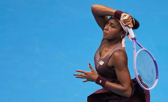 Coco Gauff of the United States returns a ball to Elise Mertens of Belgium during the fourth round of the women's singles match at the China Open tennis tournament in Beijing, Wednesday, Oct. 7, 2026. (AP Photo/Andy Wong)
