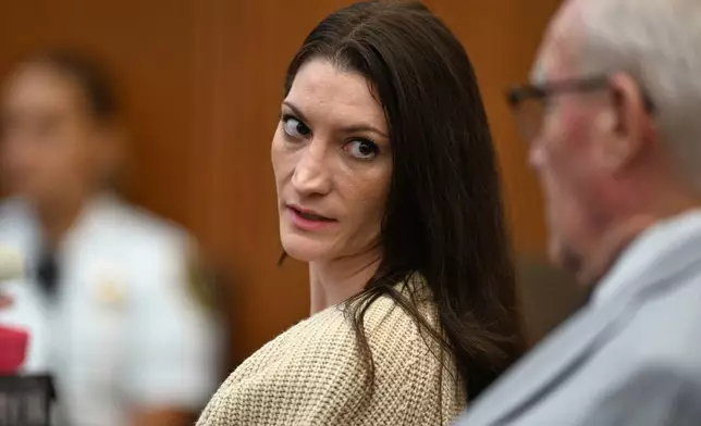 FILE - Lindsay Clancy, center, speaks with her lawyer Kevin Reddington during proceedings in her murder trial, Aug. 20, 2026, in Plymouth, Mass. (AP Photo/Josh Reynolds, Pool, File)