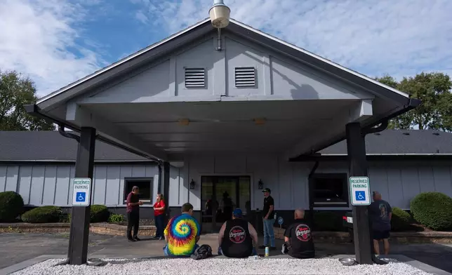 Members of UAW Local 402 gather outside their union hall, in Springfield, Ohio, Wednesday, Sept. 30, 2026, old Navistar's last day at its Springfield plant. (AP Photo/Carolyn Kaster)