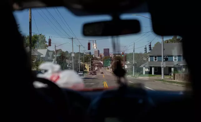 Morgan Hughes, left, and Jordan "JoJo" Burkhard, right, both members of UAW Local 402, in Springfield, Ohio, drive through Dayton Ohio, as they canvas for votes Monday, Sept. 28, 2026. (AP Photo/Carolyn Kaster)