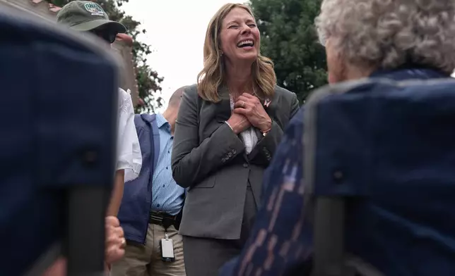 Democratic gubernatorial candidate Dr. Amy Acton visits with supporters during a campaign event along the Ohio River, in Marietta, Ohio, Thursday, Sept. 17, 2026. (AP Photo/Carolyn Kaster)