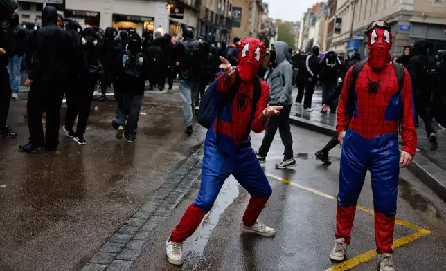 Protesters dressed as Spider-Man attend a demonstration against rising living costs in Rennes, France, Saturday, Oct. 24, 2026. (AP Photo/Jeremias Gonzalez)