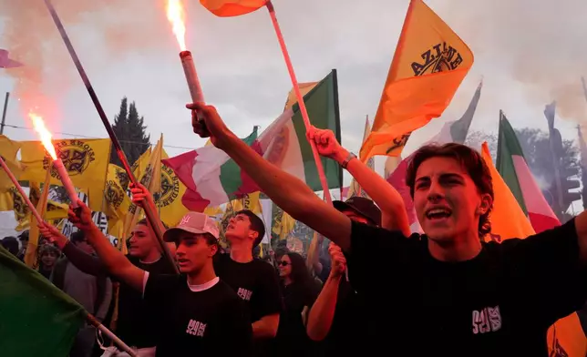 Members of right-wing student groups march through the streets of Rome, Saturday, Oct. 24, 2026, during a demonstration called "Unlock Everything," organized in opposition to recent left-wing student protests and one of several demonstrations held by groups across the political spectrum. (AP Photo/Gregorio Borgia)