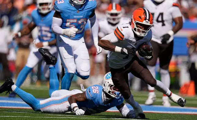 Cleveland Browns wide receiver KC Concepcion (1) gets past Tennessee Titans cornerback Marcus Harris (26) for a first down during the first half of an NFL football game in Nashville, Tenn., Sunday, Oct. 25, 2026. (AP Photo/George Walker IV)