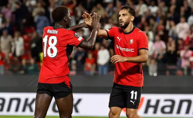Rennes' Aboubakar Nagida, left, celebrates with his teammate Musa Al-Taamari, after he scored his side's first goal during the Europa League opening phase soccer match between Rennes and OFI, in Rennes, western France, Thursday, Oct. 15, 2026. (AP Photo/Jeremias Gonzalez)
