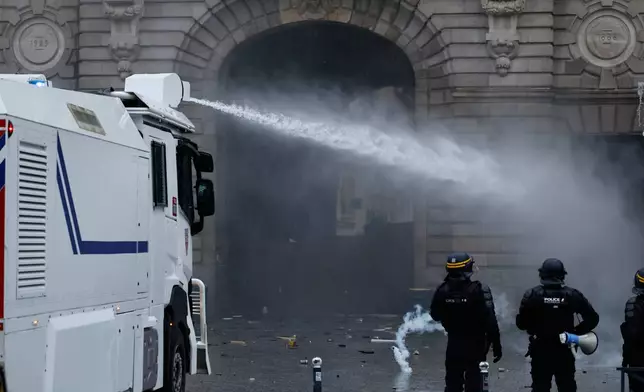 Police use a water cannon after a demonstration against rising living costs in Rennes, France, Saturday, Oct. 24, 2026. (AP Photo/Jeremias Gonzalez)