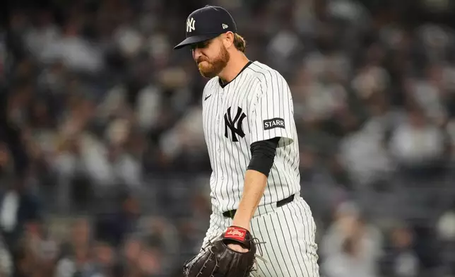 New York Yankees pitcher Paul Blackburn walks to the dugout after being pulled during the eighth inning in Game 3 of baseball's American League Division Series against the Tampa Bay Rays, Wednesday, Oct. 7, 2026, in New York. (AP Photo/Yuki Iwamura)