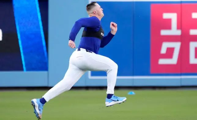 Los Angeles Dodgers pitcher Tarik Skubal warms up during practice ahead of a baseball NL Division Series Friday, Oct. 2, 2026, in Los Angeles. (AP Photo/Mark J. Terrill)