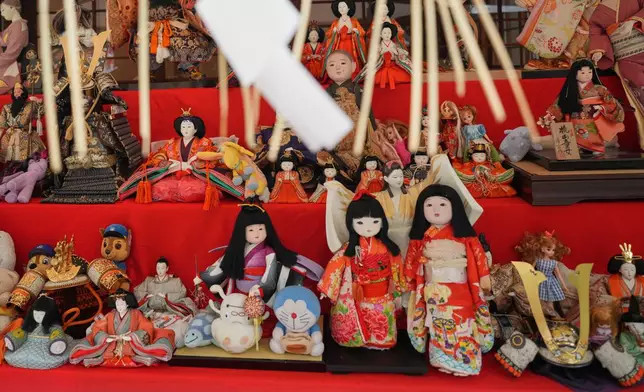 Dolls and stuffed toys no longer used by their owners are seen during a doll memorial ceremony at Dairokuten Sakaki Shrine in Tokyo, Tuesday, Oct. 13, 2026. (AP Photo/Eugene Hoshiko)