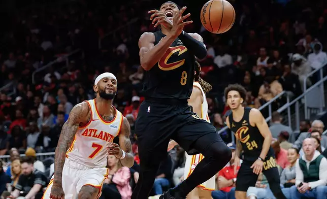 Cleveland Cavaliers guard Peyton Watson (8) loses the ball out of bounds against Atlanta Hawks guard Nickeil Alexander-Walker (7) during the first half of an NBA basketball game, Thursday, Oct. 29, 2026, in Atlanta. (AP Photo/Erik S. Lesser)