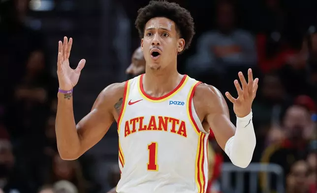 Atlanta Hawks forward Jalen Johnson reacts after being called for traveling during the first half of an NBA basketball game against the Cleveland Cavaliers, Thursday, Oct. 29, 2026, in Atlanta. (AP Photo/Erik S. Lesser)
