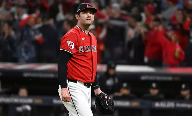 Cleveland Guardians pitcher Gavin Williams walks to the dugout during the second inning of Game 5 of baseball's American League Division Series against the Chicago White Sox, Saturday, Oct. 10, 2026, in Cleveland. (AP Photo/Phil Long)