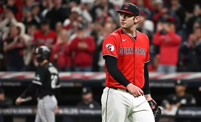 Cleveland Guardians pitcher Gavin Williams walks to the dugout after being taken out of the game in the sixth inning of Game 5 of baseball's American League Division Series against the Chicago White Sox, Saturday, Oct. 10, 2026, in Cleveland. (AP Photo/Phil Long)