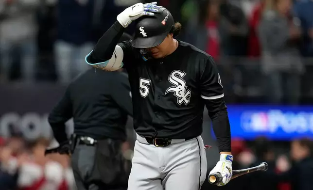 Chicago White Sox first baseman Munetaka Murakami walks back to the dugout after striking out in the sixth inning of Game 5 of baseball's American League Division Series against the Cleveland Guardians, Saturday, Oct. 10, 2026, in Cleveland. (AP Photo/Sue Ogrocki)